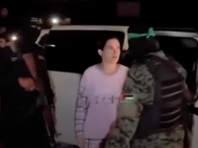 Rimon Kirsht, 36, gives one of her captors a cold stare just before she is freed.