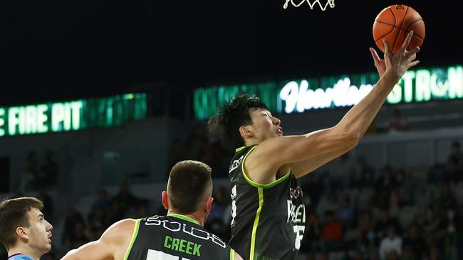 Zhou Qi rebounds the ball against the New Zealand Breakers at John Cain Arena. Picture: Getty Images