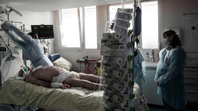 Medical staff tend to a COVID-19 patient in an intensive care unit at the AP-HP Louis Mourier hospital in Colombes, northwest of Paris. Picture: AFP