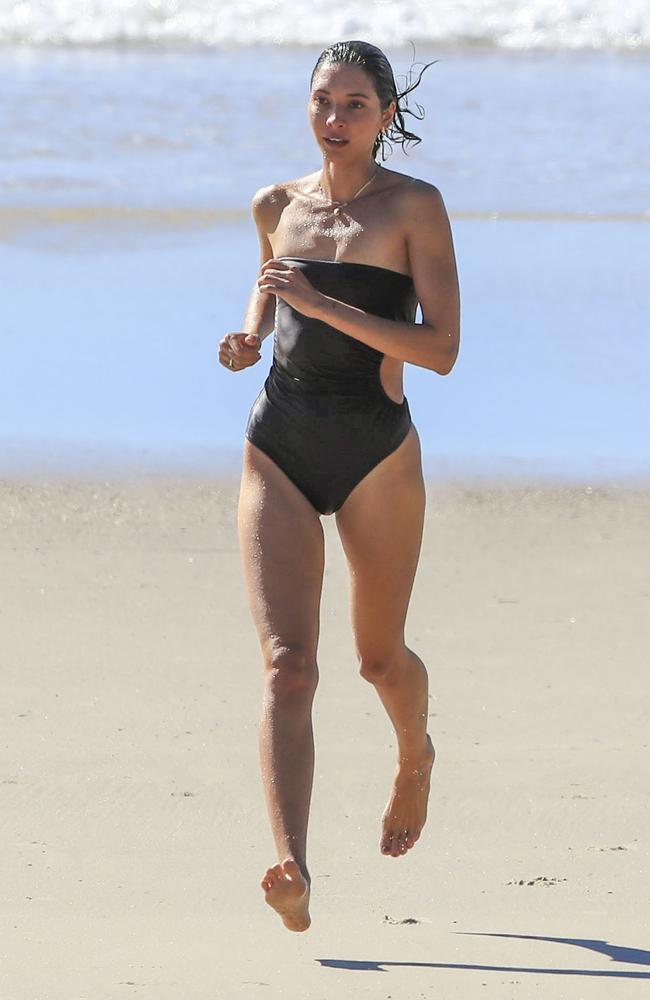 The 25-year-old model ran along the sand after her swim. Picture: Media Mode.