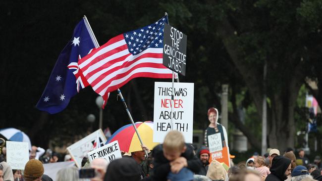 Protesters waves the Australian and US flags. Picture: Tim Hunter