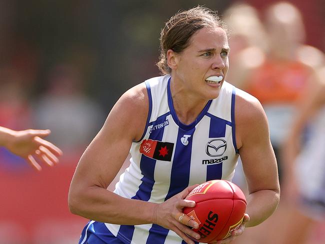 MELBOURNE, AUSTRALIA - OCTOBER 01: Jasmine Garner of the Kangaroos runs with the ball during the round five AFLW match between North Melbourne Tasmania Kangaroos and Greater Western Sydney Giants at Arden Street Ground, on October 01, 2023, in Melbourne, Australia. (Photo by Kelly Defina/Getty Images)