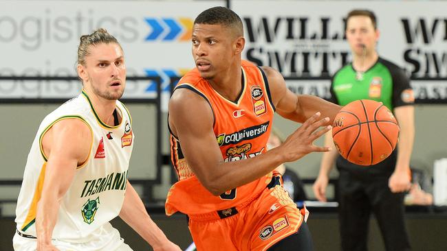 Scott Machado of the Taipans dribbles the ball.