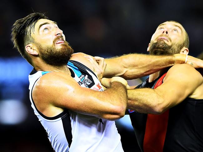 MELBOURNE, AUSTRALIA - APRIL 15:  Charlie Dixon of Port Adelaide and Tom Bellchambers of the Bombers battle iyt out in the ruck during the round four AFL match between the Essendon Bombers and the Port Adelaide Power at Etihad Stadium on April 15, 2018 in Melbourne, Australia.  (Photo by Mark Brake/Getty Images)