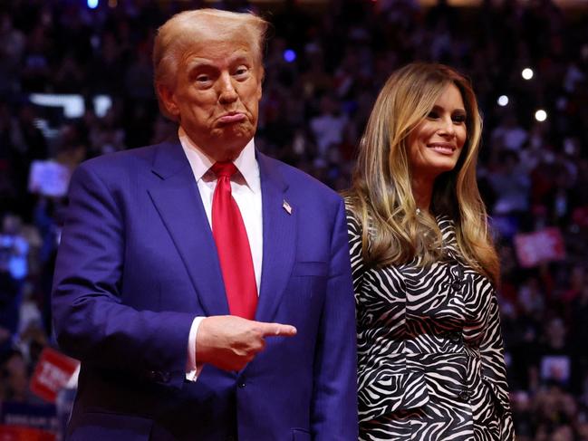 Republican presidential nominee and former U.S. President Donald Trump points his finger next to Melania Trump during a campaign rally at Madison Square Garden, in New York, U.S., October 27, 2024. REUTERS/Brendan McDermid