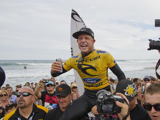 Surfer Mick Fanning celebrates after he won the Rip Curl Pro at Bells Beach in Victoria, 06/04/2012.