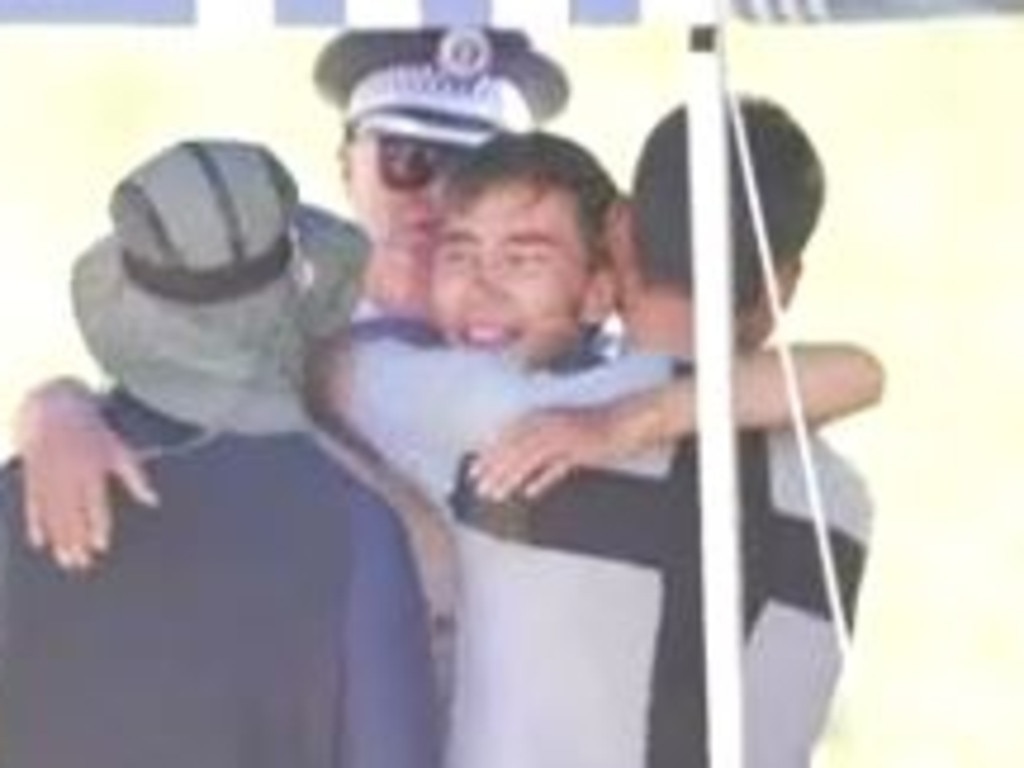 Hadi Nazari in an embrace with friends after he was found alive. Picture: ABC