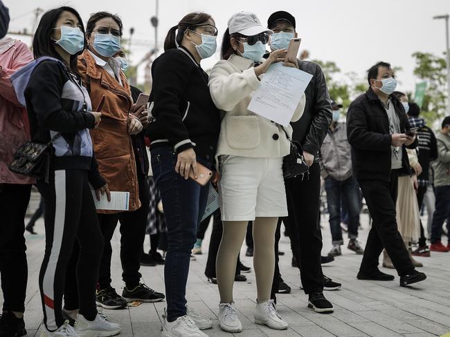 Locals line up at a job fair in Wuhan. Picture: Getty Images