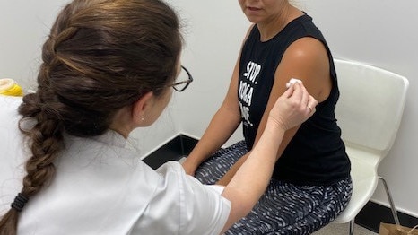 Tanya Maloney giving a flu injection at Terry White Chemmart.