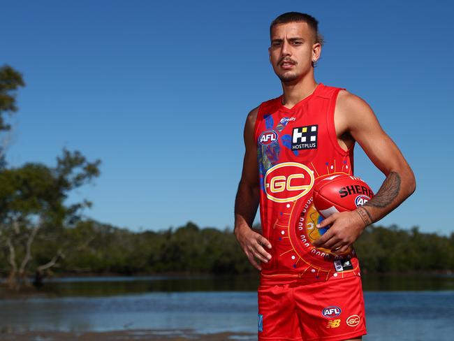 GOLD COAST, AUSTRALIA - MAY 14: Joel Jeffrey poses during the unveiling of the Gold Coast Suns 2021 Indigenous AFL guernsey at Tallebudgera Creek on May 14, 2021 in Gold Coast, Australia. (Photo by Chris Hyde/Getty Images)