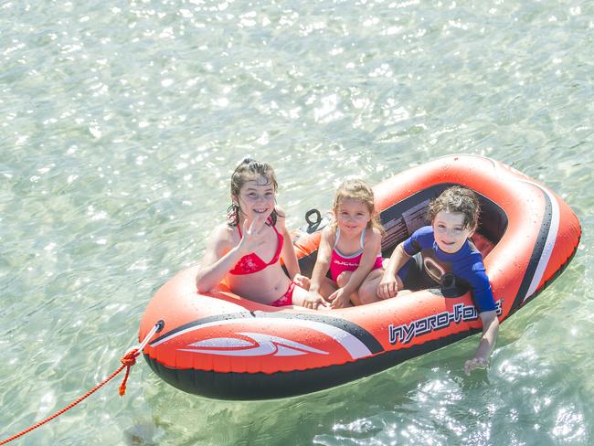 Alexandra and Matthew Fairchild with their cousin Isabella Hutchins (centre) on a boat at Sorrento on December 31, 2014. Picture: Eugene Hyland