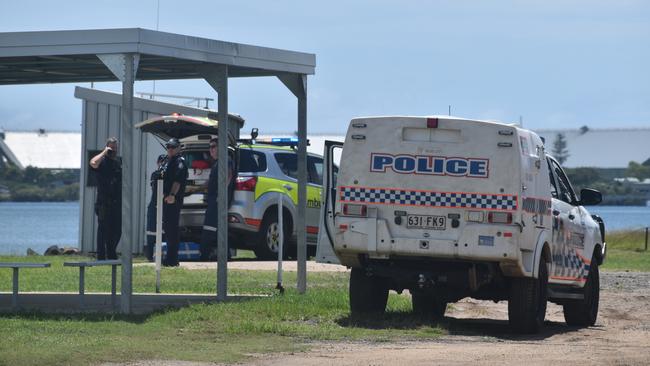 Police investigate the scene on the banks of the Burnett River and interview boaties following a serious boat crash.