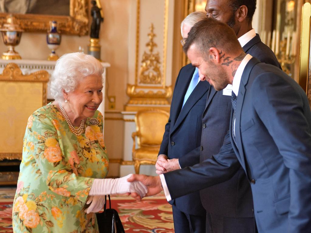 Queen Elizabeth II greets the former England international before the Queen's Young Leaders Awards Ceremony in 2018. Picture: AFP.