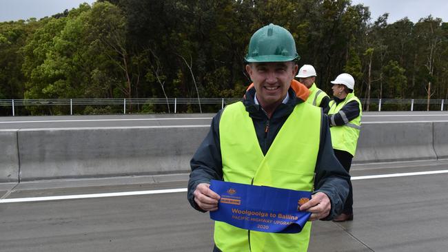 Page MP Kevin Hogan with part of the ceremonial ribbon for the completion of the Woolgoolga to Ballina Pacific Highway Upgrade.