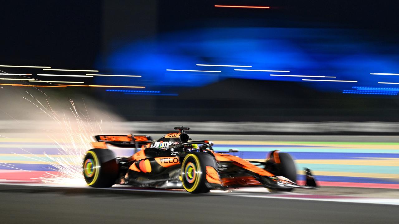 LUSAIL CITY, QATAR - NOVEMBER 29: Sparks fly behind Oscar Piastri of Australia driving the (81) McLaren MCL38 Mercedes during Sprint Qualifying ahead of the F1 Grand Prix of Qatar at Lusail International Circuit on November 29, 2024 in Lusail City, Qatar. (Photo by Clive Mason/Getty Images)