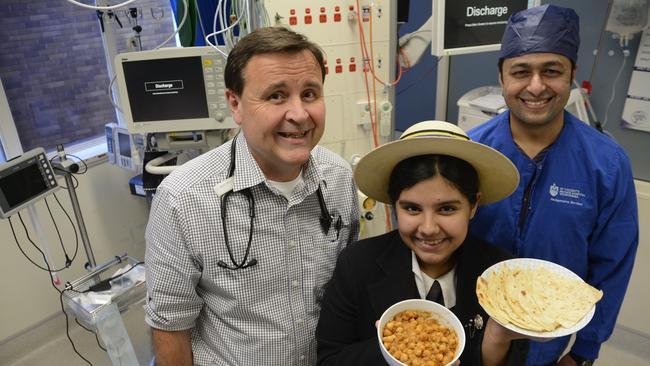 Enjoying a good chickpea curry are (from left) Dr Alan Rouse, Toowoomba's youngest cook Radhika Bhardwaj and Dr Sandeep Phaltane, at the St Vincent's Hospital Intensive Care Unit.