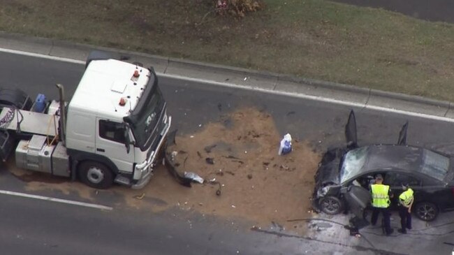 Horror scenes after a vehicle and a truck collided after Arundel. Picture: 7News