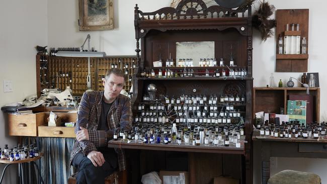 Jonsi with his "perfumery organ" – a perfume blending table built out of the remnants of an old organ – at his home in Los Angeles in 2021. Picture: Paul Salveson