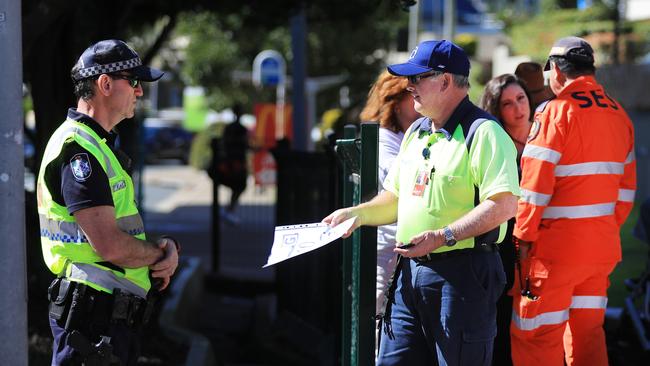 August 9, 10.35am, Griffith Street Coolangatta, Pedestrian foot traffic is stopped and checked for border passes as Queensland steps up its tightened security with Covid restrictions. Scott Powick Newscorp