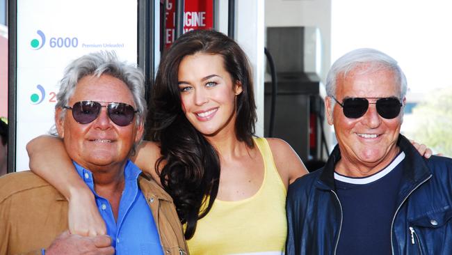 Harry and George with model Megan Gale, giving away petrol on behalf of David Jones at Mobil in Pulteney Street.