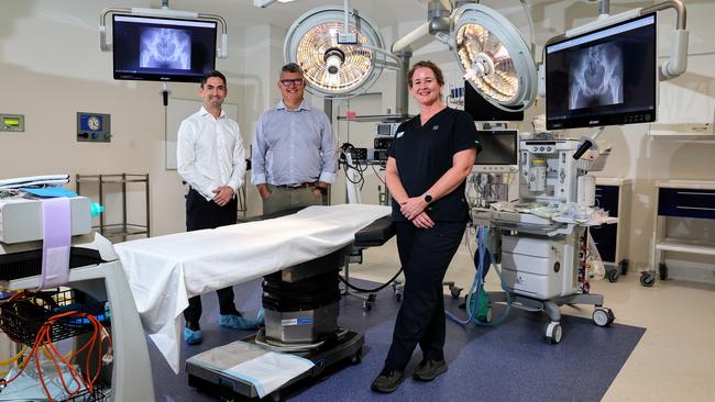 A brand new arthroscopic and laparoscopic operating theatre will open at the Cairns Private Hospital on Tuesday, which uses the latest technology to make complex surgeries more efficient and deliver better patient outcomes. Cairns Private Hospital chief executive Ben Tooth, director of medical services Chris Morrey and theatre development project co-ordinator Hannah Brien inspect the new integrated stryker operating system in the newly completed theatre. Picture: Brendan Radke