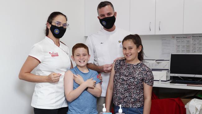 Pharmacist Georgina Twomey with her son Archer Twomey, 8, daughter Scarlett Twomey, 10 and Pharmacy Guild of Australia national president Trent Twomey at their Alive pharmacy in Westcourt. Picture: Brendan Radke