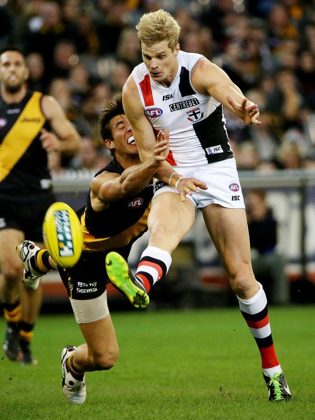 St Kilda legend Nick Riewoldt gets a kick away.