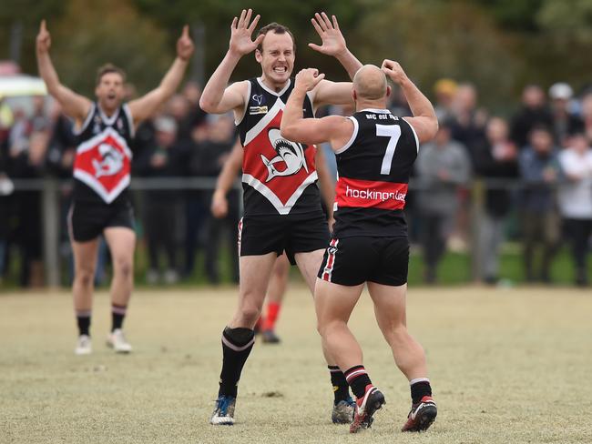 Bonbeach ruckman Dylan Jones high fives teammate Shane McDonald.