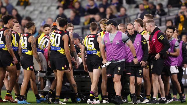 The players got around the youngster. Photo by Darrian Traynor/AFL Photos/via Getty Images