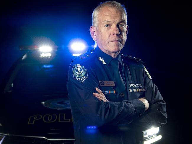 Police Commissioner Grant Stevens poses in front of Police Car lights Monday December ,13,2021.Picture Mark Brake