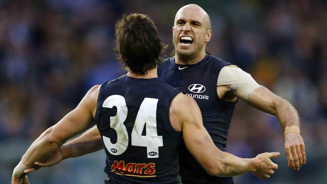 Judd celebrates with Nick Duigan as the Blues kick clear of Richmond in the 2013 elimination final.