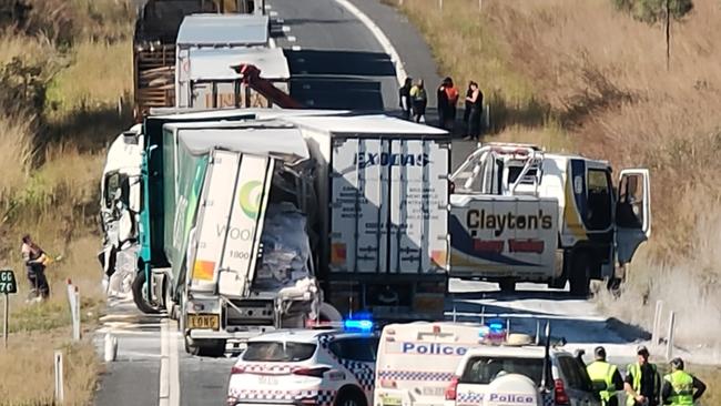 A Claytons towing truck driver prepares to hitch up the wreckage of a truck crash about 35km south of Miriam Vale on the Bruce Highway on August 6. Picture: Rodney Stevens