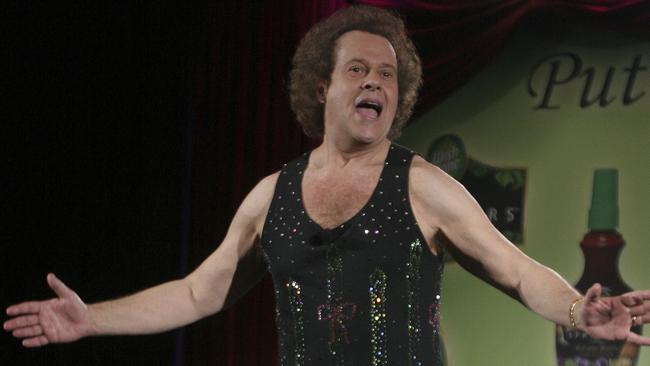 Richard Simmons speaks to the audience before the start of a summer salad fashion show at Grand Central Terminal in New York in 2006.