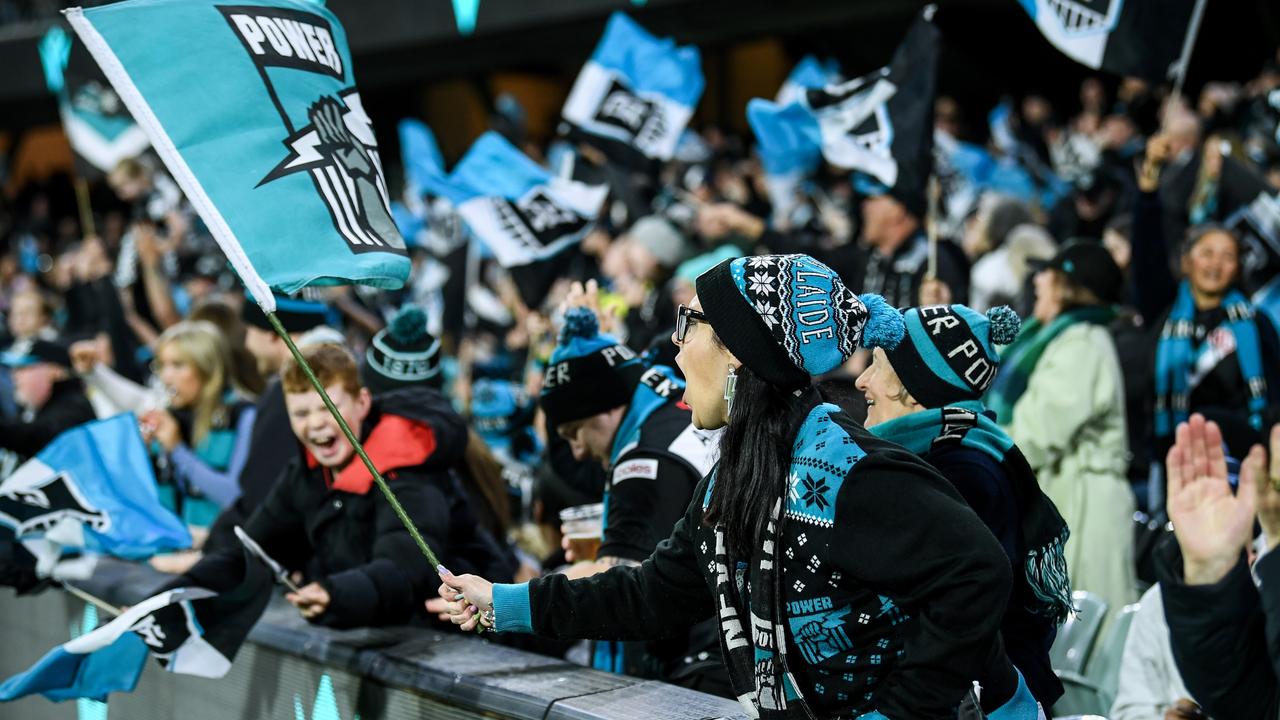 Port Adelaide fans celebrate a goal during last weekend’s home win over Fremantle. Picture: Mark Brake/Getty Images