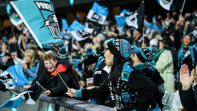 Port Adelaide fans celebrate a goal during last weekend’s home win over Fremantle. Picture: Mark Brake/Getty Images