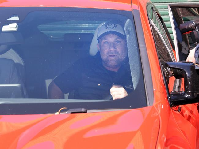 Former Australian cricketer Michael Slater is driven away from Manly Police station in October, 2021. Picture: Richard Dobson