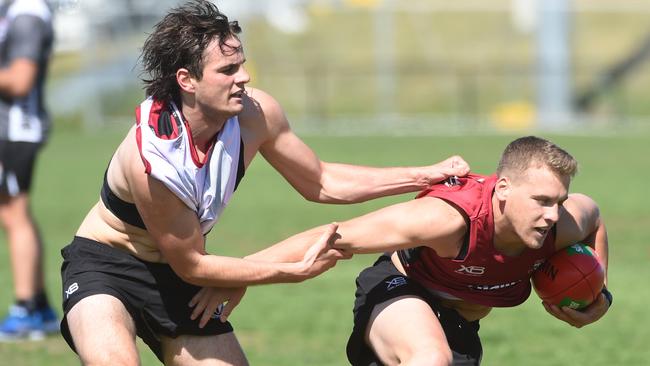 Dylan Roberton tackles small-forward Jack Lonie.