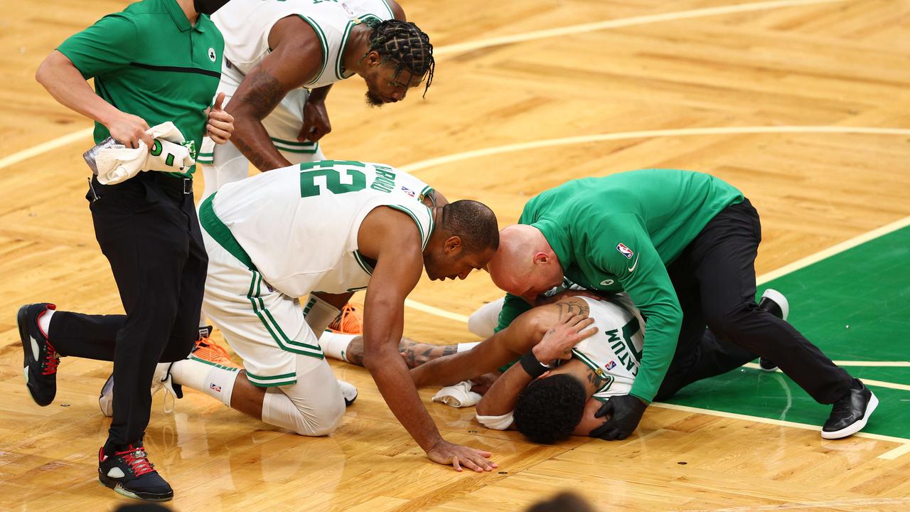 Jayson Tatum of the Boston Celtics lies on the court after a possible injury in the fourth quarter. Elsa/Getty Images/AFP