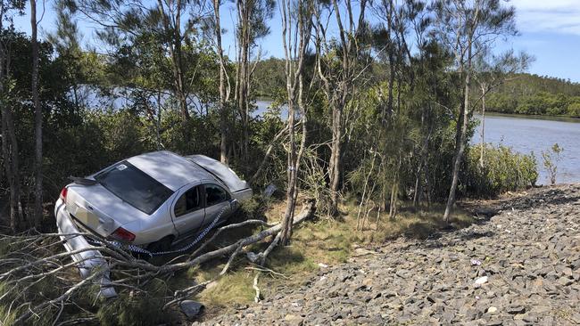 A car which left Yamba Road near Romiaka Channel and crashed into trees near the waterway has been left for three days.