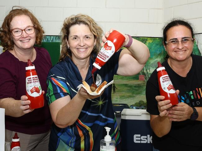 Hannah Klee, Liza Parr and Carla Eisemberg at Nakara Primary School showing off the Democracy Sauce donated by Masterfoods. Picture: Pema Tamang Pakhrin