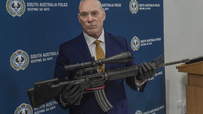 Detective Superintendent Steve Taylor with the AR15 semiautomatic rifle seized last year. Picture: Roy Van Der Vegt