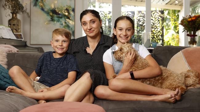 War widow Gwen Cherne with her children Lachlan and Emily and dog Scout. Picture: Tim Hunter.