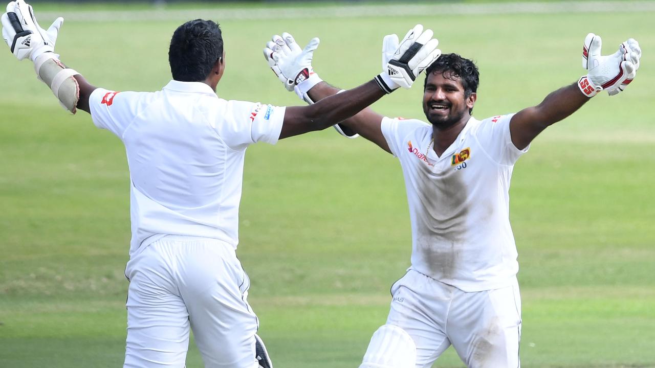 Vishwa Fernando and Kusal Perera celebrate one of Test cricket’s biggest underdog wins. 