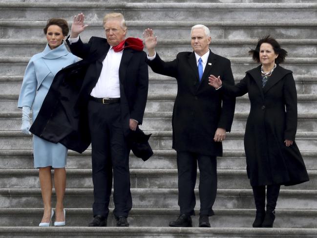 First lady Melania Trump, President Donald Trump, Vice President Mike Pence and his wife Karen wave to former President Barack Obama as he departs in a Marine helicopter on the East Front of the U.S. Capitol in Washington on January 20, 2017. Picture: AP
