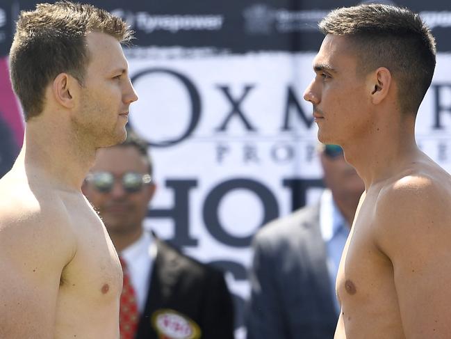 Jeff Horn (left) and Tim Tszyu at yesterday’s weigh-in in Townsville. Picture: Ian Hitchcock/Getty Images