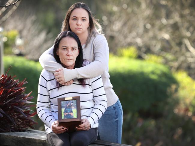 Tonyalee and Caroline pictured holding Onyx's ashes, says they were forced to put him down after three "botched" surgeries by Melbourne vet, Dr Chris Preston, in May this year. Picture: David Caird