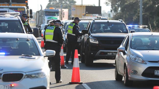 Police checking drivers on the way to Phillip Island, with a roadblock near Lang Lang, on the Bass Hwy. Picture: Alex Coppel.