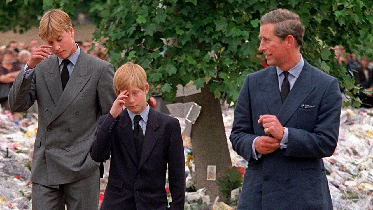 Prince Charles and his sons Prince William, left and Prince Harry as they arrived at Kensington Palace to view tributes left in memory of their mother Princess Diana in 1997. Picture: AP