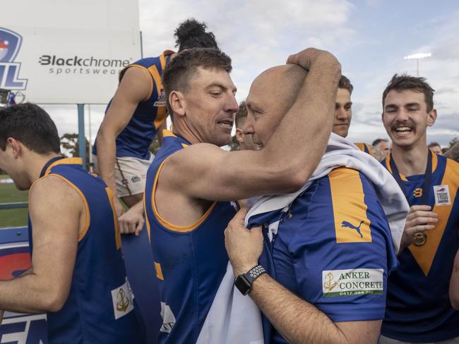 Eagles coach Steve O’Brien is embraced by his players. Picture: Valeriu Campan