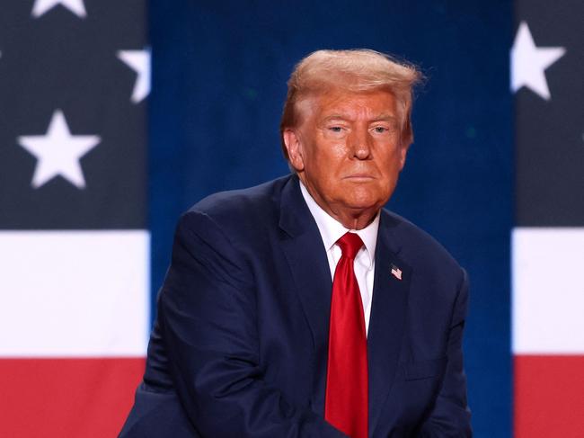 TOPSHOT - Former US President and Republican presidential candidate Donald Trump looks on during a town hall event at the Crown Complex in Fayetteville, North Carolina, on October 4, 2024. (Photo by Logan Cyrus / AFP)